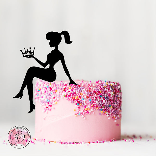 Sitting girl silhouette holding crown cake topper